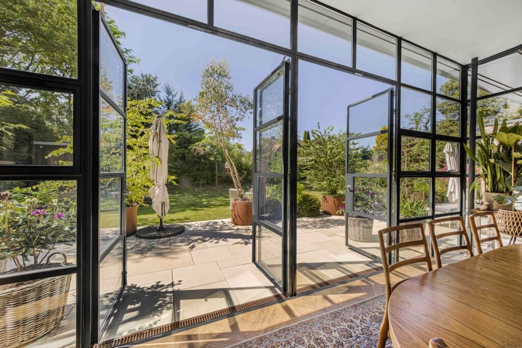 Property Photography Manchester- Glass Facade Opening to Garden