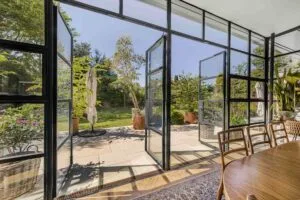 Property Photography Manchester- Glass Facade Opening to Garden